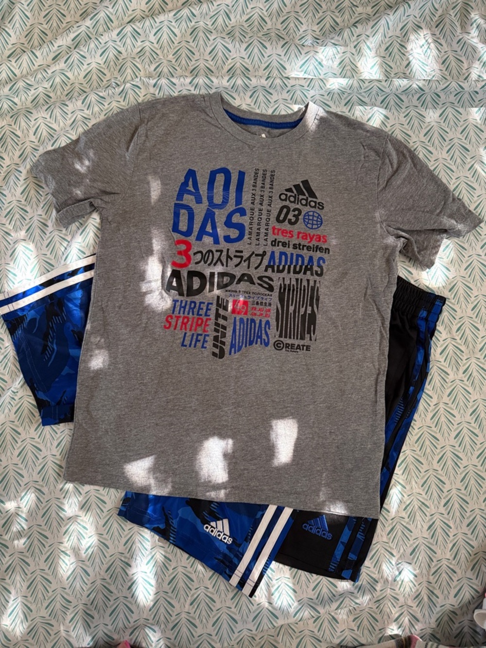 2 boys medium Adidas shorts and matching tshirt.
